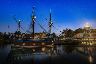 The Elizabeth II sailing ship replica and Roanoke River Light at night